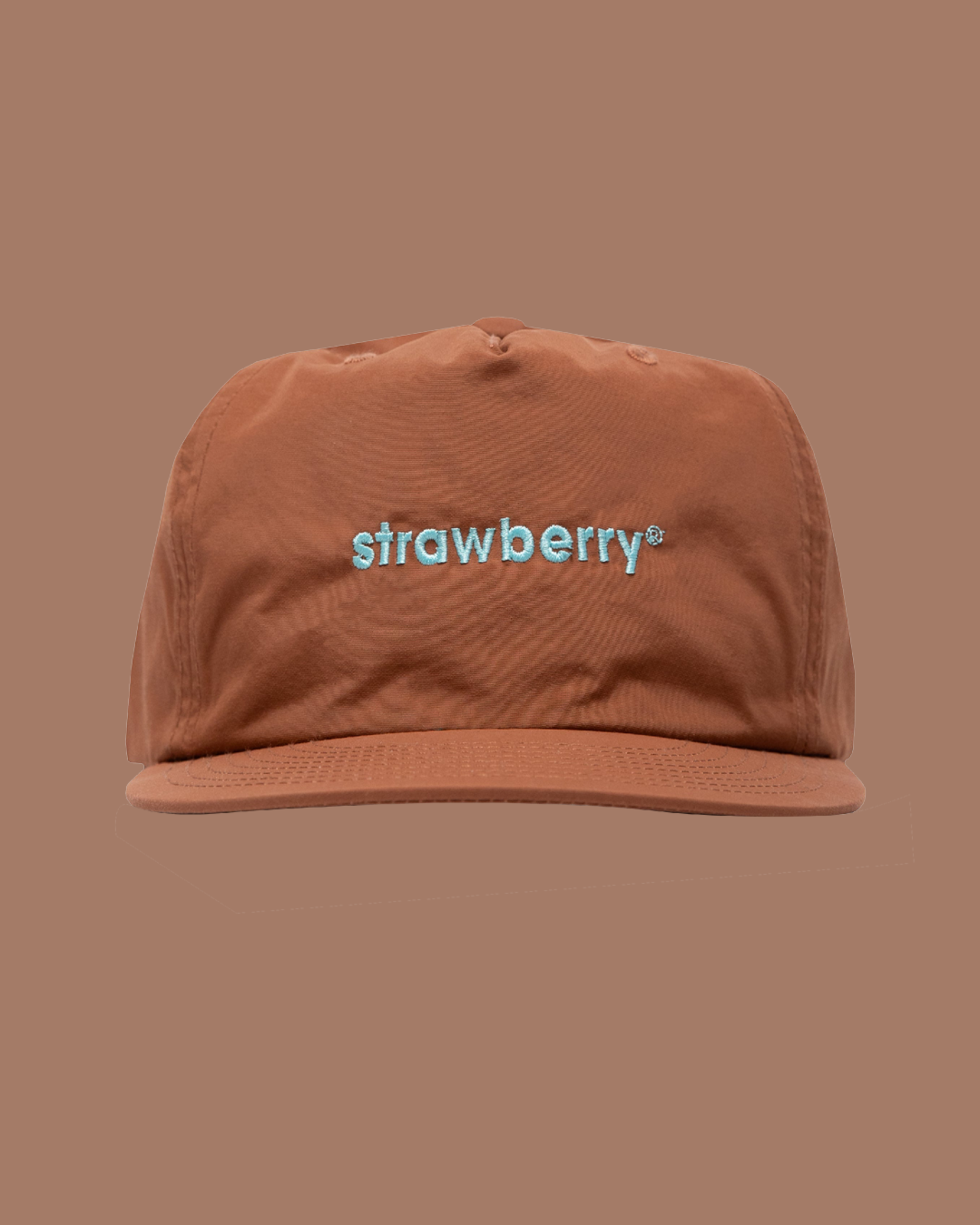 A brown cap with "strawberry" embroidered in light blue on the front. The background is a matching brown color.